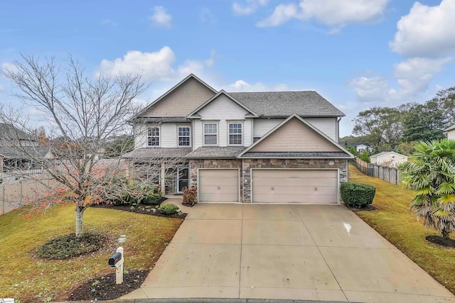 craftsman-style house with a garage and a front yard