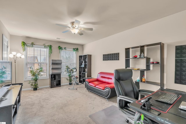 office space featuring carpet floors and ceiling fan