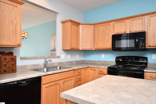 kitchen featuring light brown cabinets, sink, and black appliances