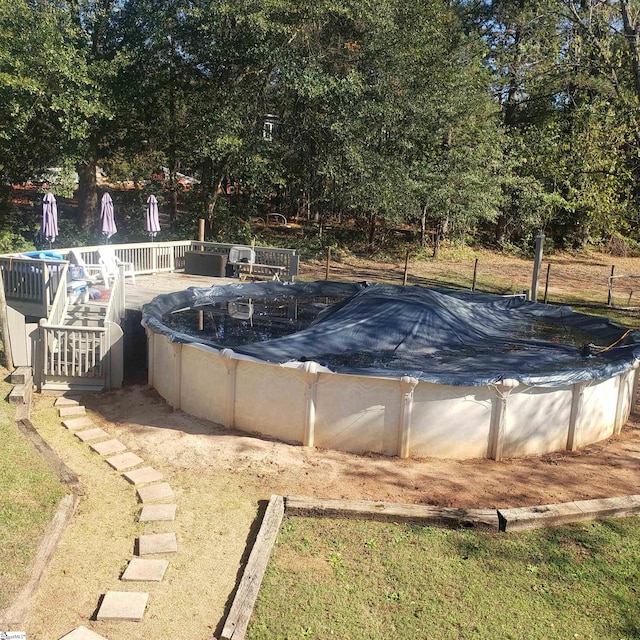 view of pool with a wooden deck