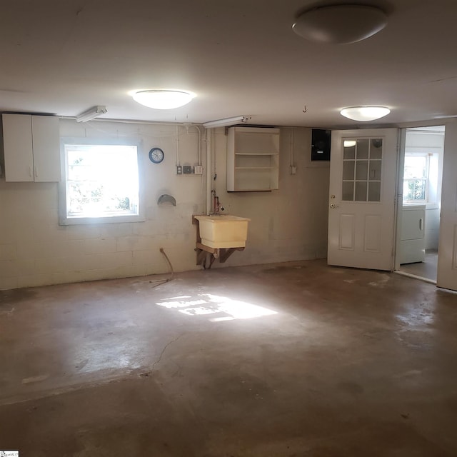 basement with washer / clothes dryer and sink