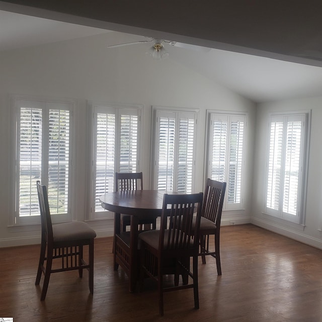 dining room featuring ceiling fan, dark hardwood / wood-style flooring, and lofted ceiling