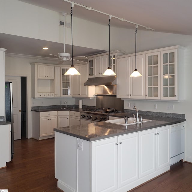 kitchen featuring dishwasher, white cabinetry, hanging light fixtures, and kitchen peninsula