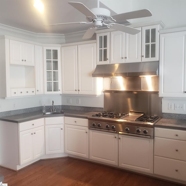 kitchen with sink, ceiling fan, dark hardwood / wood-style flooring, white cabinetry, and stainless steel gas cooktop