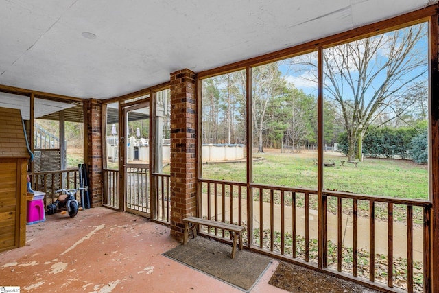 unfurnished sunroom with plenty of natural light