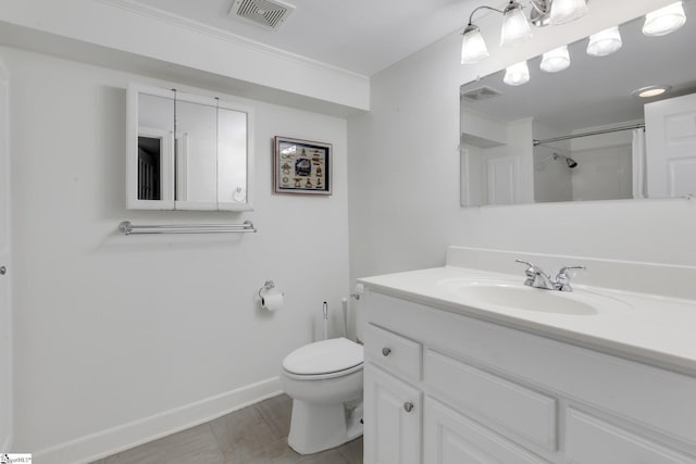 bathroom featuring vanity, toilet, and walk in shower