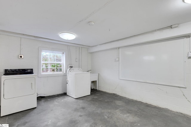 washroom with washing machine and clothes dryer