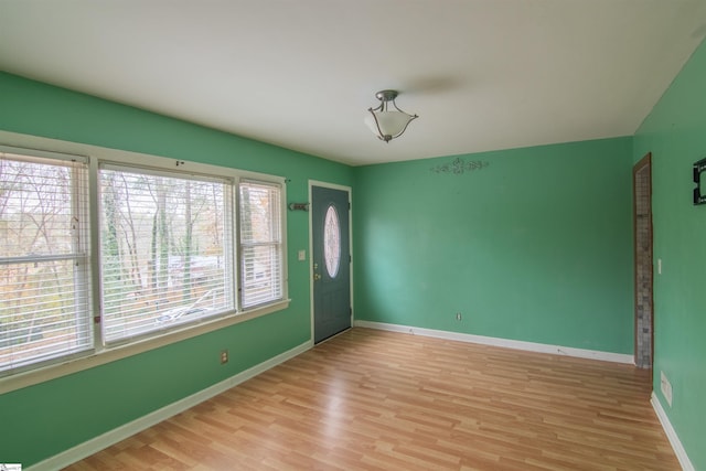 unfurnished room with light hardwood / wood-style flooring