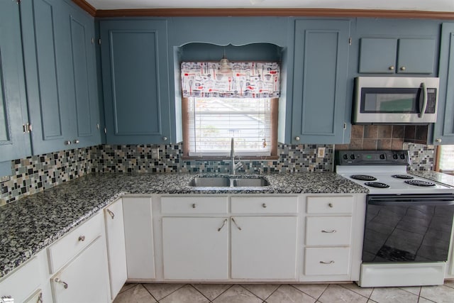 kitchen with tasteful backsplash, blue cabinets, sink, white electric stove, and white cabinetry