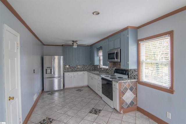 kitchen featuring tasteful backsplash, stainless steel appliances, ceiling fan, blue cabinetry, and light tile patterned flooring