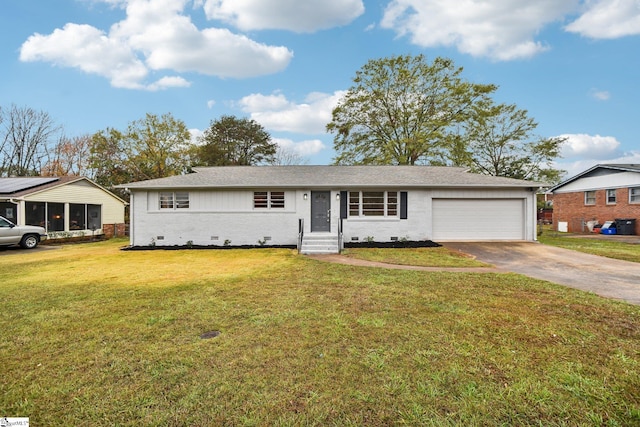 single story home featuring a front yard and a garage