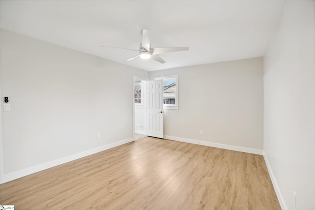 empty room with light hardwood / wood-style floors and ceiling fan