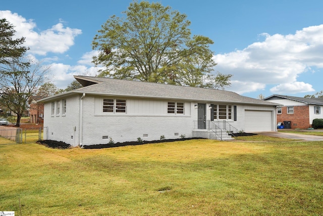 ranch-style house with a garage and a front lawn