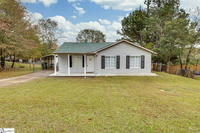 view of front of house with a front lawn, covered porch, and a carport