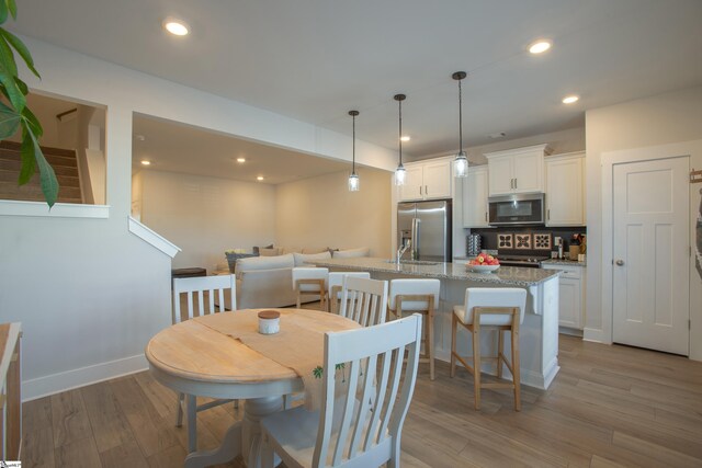 dining room featuring light wood-type flooring