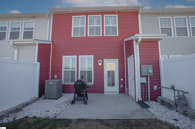 back of house featuring a patio area and central AC