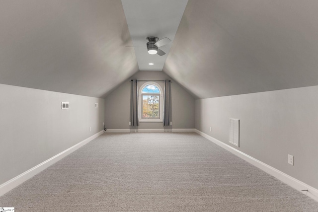 bonus room with ceiling fan, light carpet, and vaulted ceiling