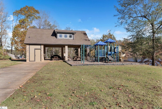 view of front of property featuring a playground and a front yard