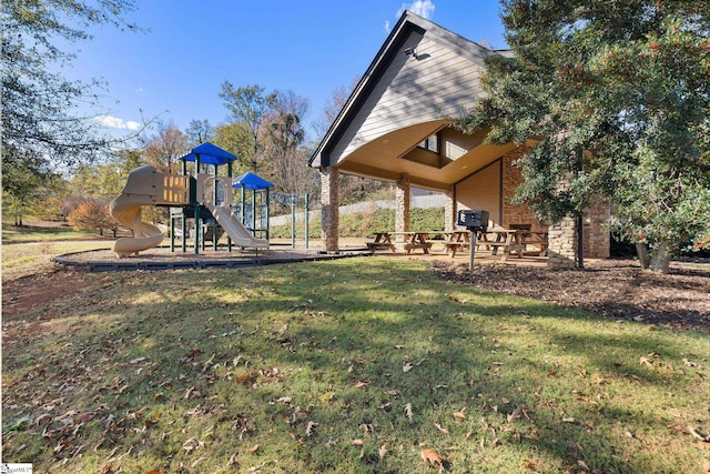 view of play area featuring a lawn