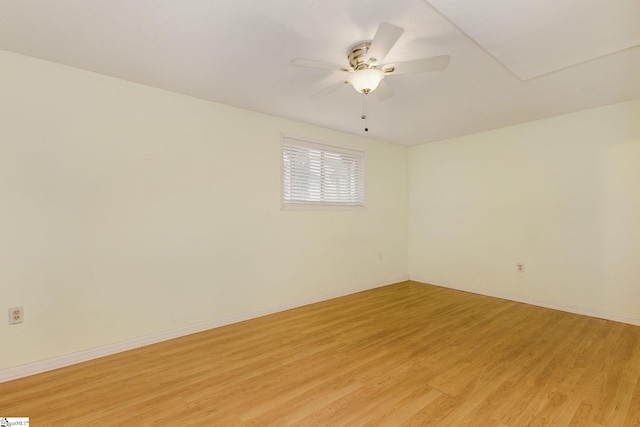 spare room with ceiling fan and light hardwood / wood-style flooring