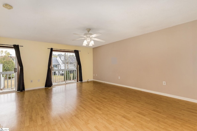 unfurnished room featuring light wood-type flooring, a wealth of natural light, and ceiling fan