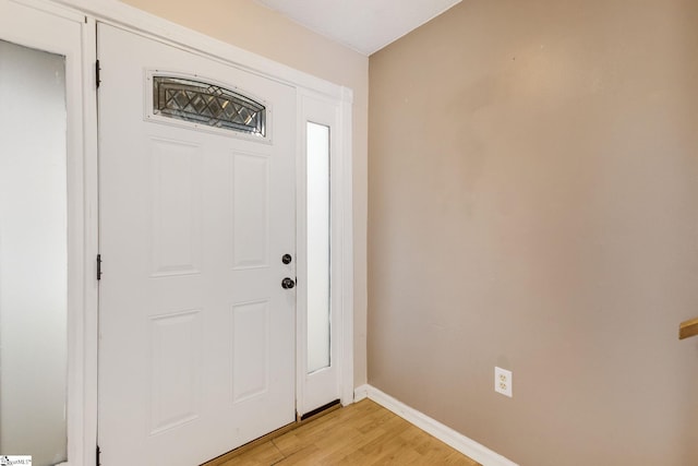 foyer with light hardwood / wood-style flooring