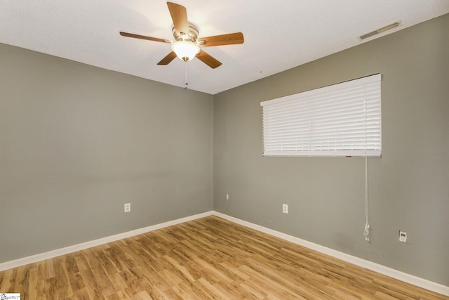 unfurnished room with ceiling fan and light wood-type flooring