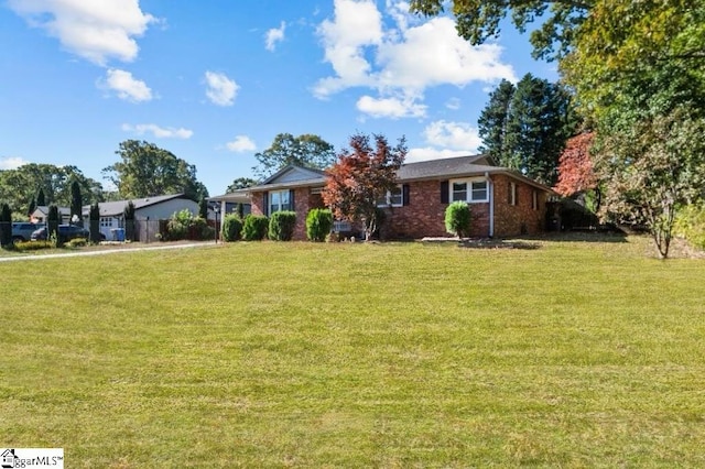 ranch-style house with a front lawn