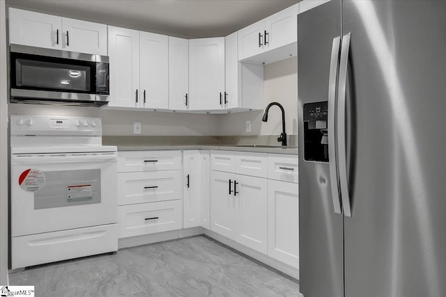 kitchen featuring white cabinets, sink, and stainless steel appliances