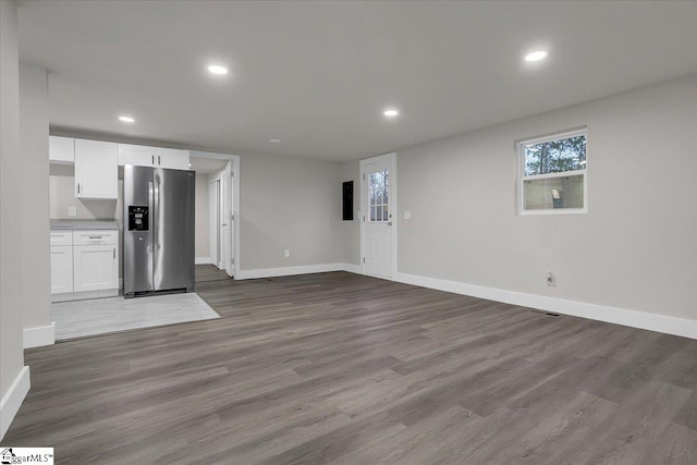 unfurnished living room featuring light wood-type flooring