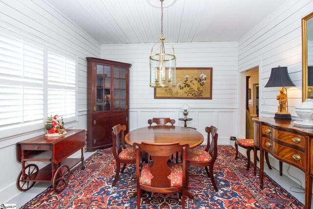 dining space featuring a notable chandelier