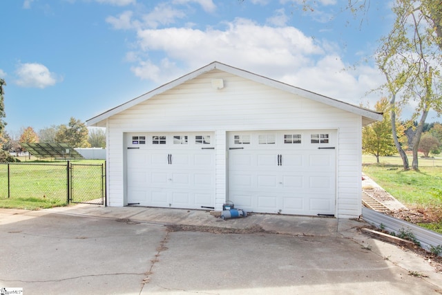 garage with a lawn