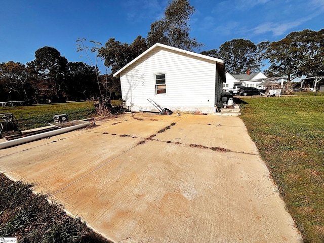 view of side of property with a yard