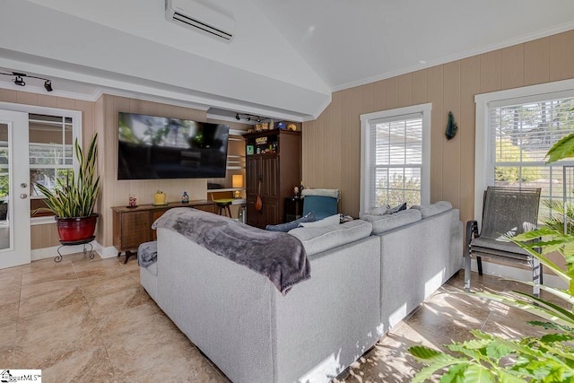 living room featuring a wall mounted AC, wooden walls, vaulted ceiling, and ornamental molding