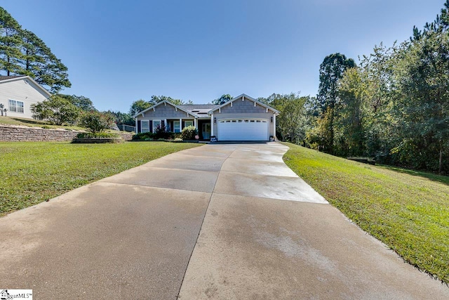 view of front of house with a front lawn and a garage