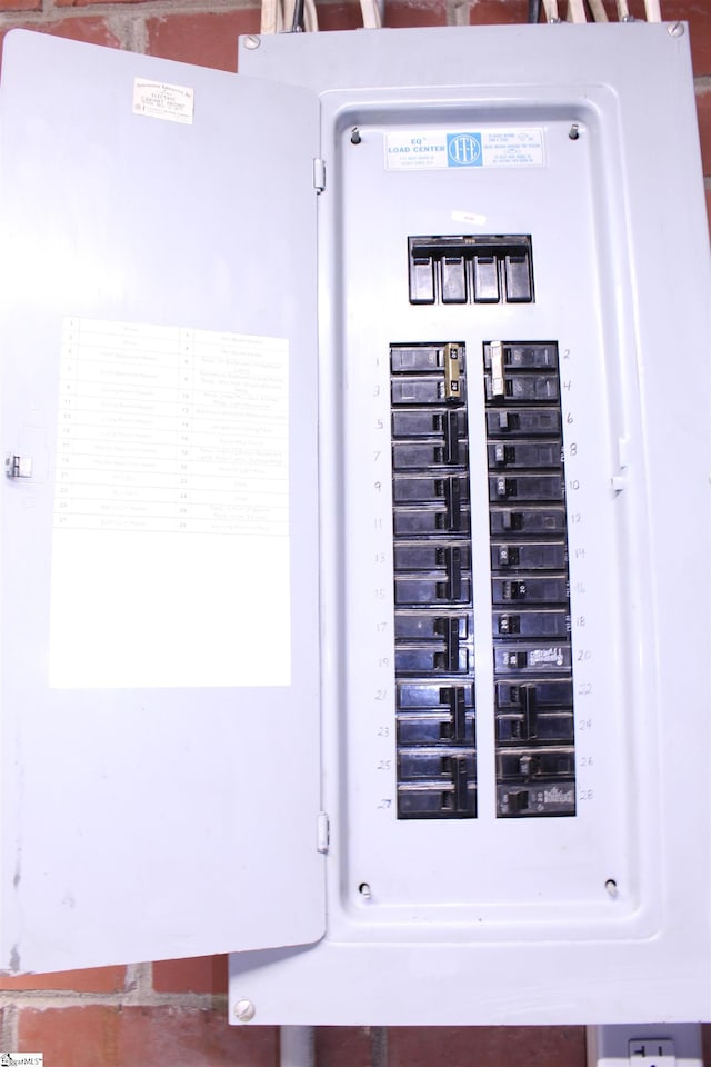 utility room featuring electric panel