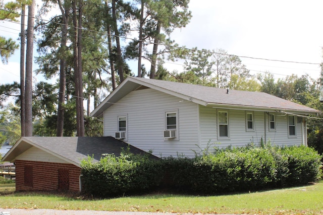 view of home's exterior with cooling unit