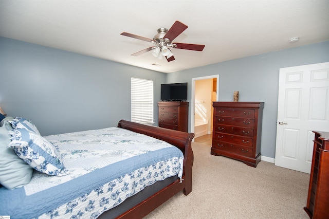 carpeted bedroom with ceiling fan and ensuite bathroom