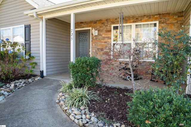 doorway to property featuring a porch