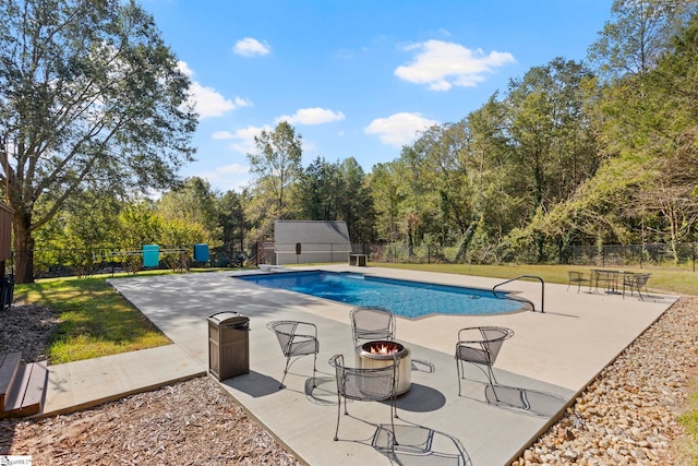 view of swimming pool featuring a patio area