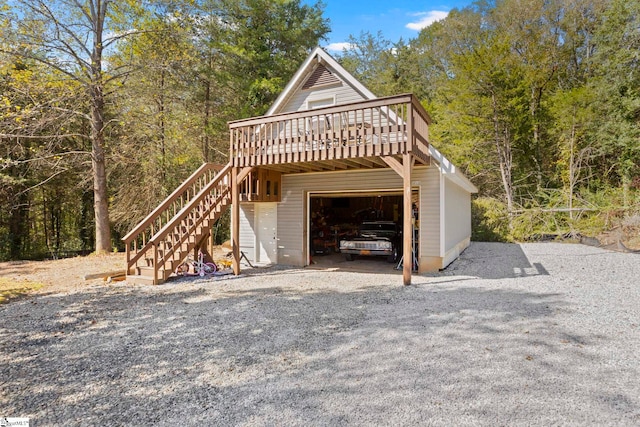 exterior space featuring a garage and a deck