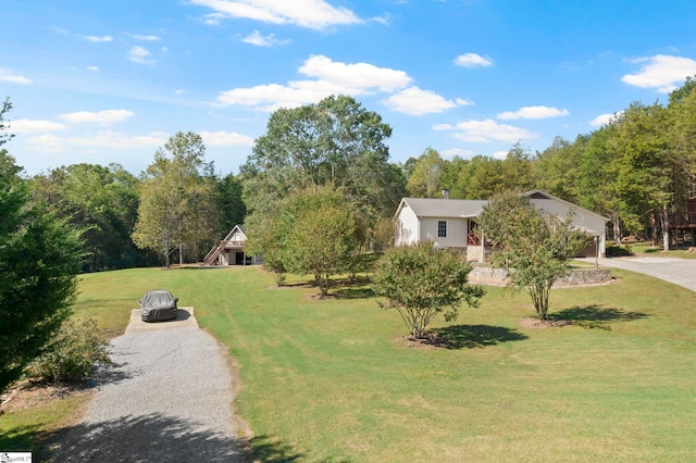 view of home's community featuring a yard