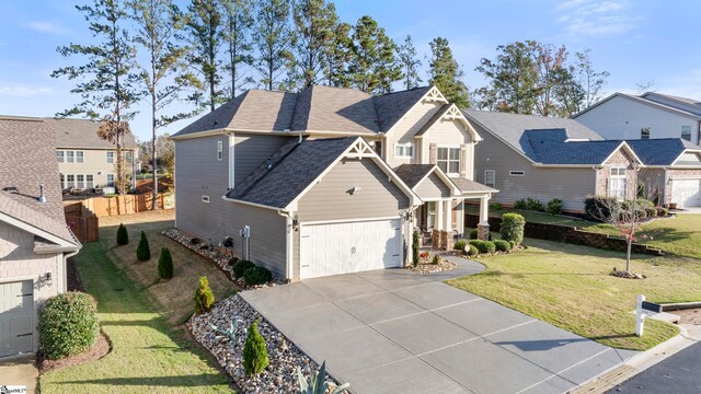 view of front facade with a garage and a front lawn