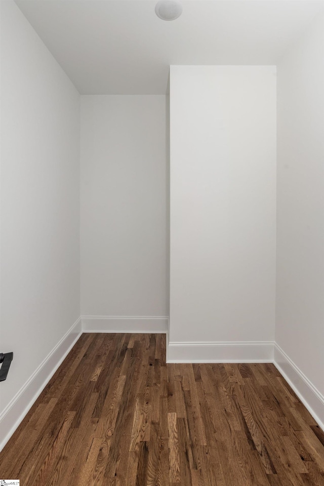 empty room featuring dark wood-type flooring