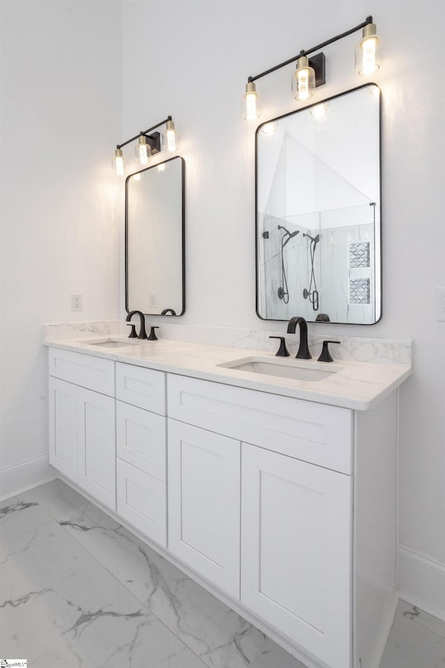 bathroom featuring a shower and vanity