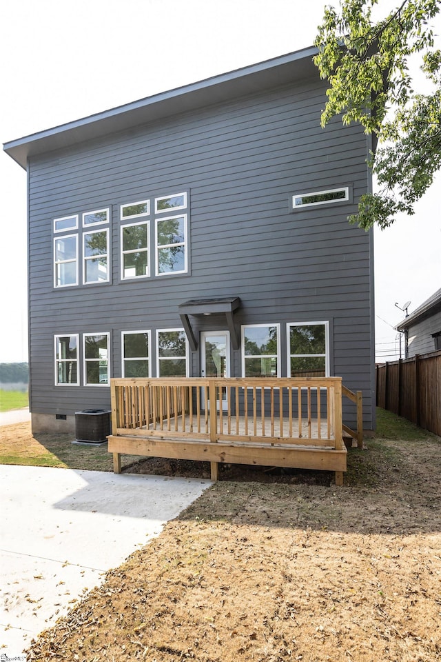 rear view of house featuring a deck