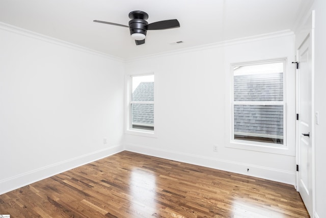 unfurnished room with hardwood / wood-style flooring, ceiling fan, and ornamental molding