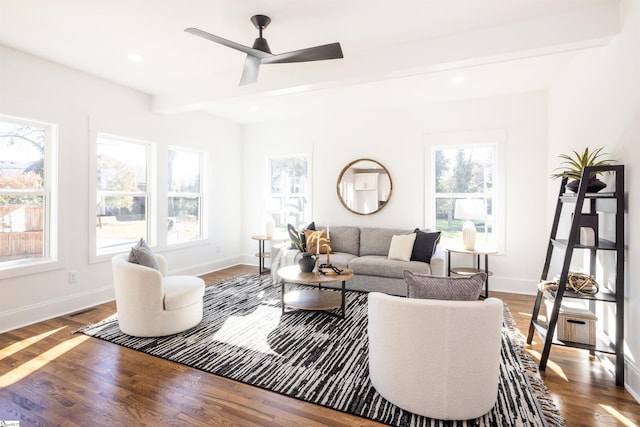 living room featuring plenty of natural light, dark wood-type flooring, and ceiling fan