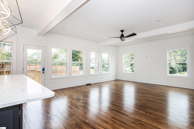 unfurnished sunroom with beam ceiling and ceiling fan