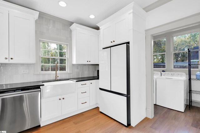 kitchen with sink, white cabinets, dishwasher, and white fridge